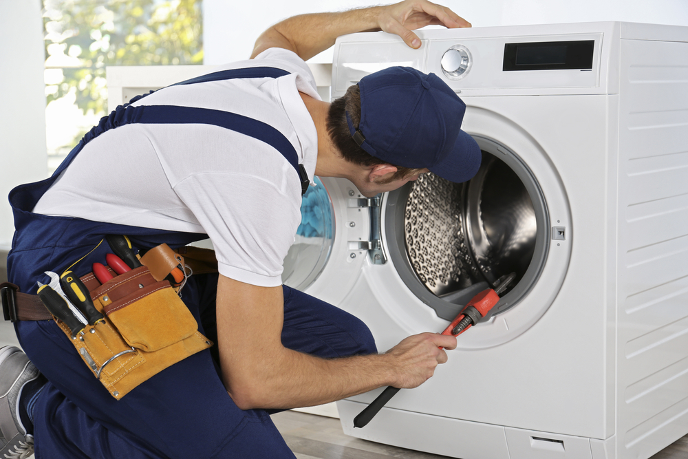 4 Common Problems With Washing Machines And How To Fix Them Man With